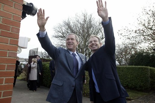President George W. Bush and Prime Minister Tony Blair wave to onlookers during the President’s visit to the Blair’s home. White House photo by Eric Draper.