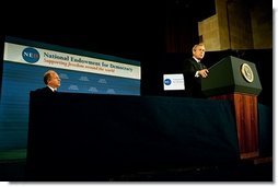President George W. Bush delivers remarks at the 20th Anniversary of the National Endowment for Democracy at the U. S. Chamber of Commerce Thursday, Nov. 6, 2003. Pictured with President Bush is Vin Weber, the endowment's chair and former Congressman from Minnesota. 