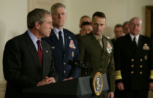 President George W. Bush speaks at the Pentagon Tuesday, March 25, 2003. Also pictured, from left, are Chairman of the Joint Chiefs of Staff General Richard B. Myers, Vice Chairman of the Joint Chiefs of Staff General Peter Pace and Chief of Naval Operations Admiral Vern Clark. White House photo by Paul Morse.