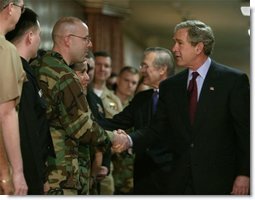 After delivering his remarks, President George W. Bush greets troops at the Pentagon Tuesday, March 25, 2003.  White House photo by Paul Morse