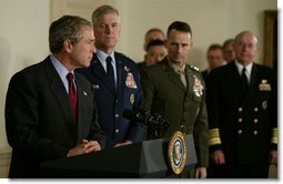 President George W. Bush speaks at the Pentagon Tuesday, March 25, 2003. Also pictured, from left, are Chairman of the Joint Chiefs of Staff General Richard B. Myers, Vice Chairman of the Joint Chiefs of Staff General Peter Pace and Chief of Naval Operations Admiral Vern Clark.  White House photo by Paul Morse