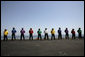 Crew members of the USS John C. Stennis stand on the deck, Friday, May 11, 2007 during Vice President Dick Cheney's arrival to the aircraft carrier. White House photo by David Bohrer