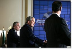 President George W. Bush smiles during a joint press conference Wednesday, March 23, 2005, after talks with Canada's Prime Minister Paul Martin, left, and Mexico's President Vicente Fox at the Bill Daniels Activity Center on the campus of Baylor University in Waco, Texas.   White House photo by Krisanne Johnson