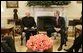 President George W. Bush talks with Bishop William Skylstad, newly elected president of the U.S. Conference of Catholic Bishops, in the Oval Office Monday, March 14, 2005. In November 2004, Bishop Skylstad was elected to a three-year term as head of the USCCB, which serves to promote, coordinate and encourage Catholic activities in the United States. White House photo by Krisanne Johnson