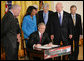 President George W. Bush signs H.R. 7081, The United States-India Nuclear Cooperation Approval and Nonproliferation Enhancement Act, Wednesday, Oct. 8, 2008, in the East Room at the White House. President Bush is joined on stage by, from left, Rep. Joseph Crowley, D-N.Y., Rep. Eliot Engel, D-N.Y., Secretary of State Condoleezza Rice, Sen. Chris Dodd, D-Conn., Senator John Warner of Virginia, Energy Secretary Samuel Bodman, and India's Ambassador to the United States Ronen Sen. White House photo by Chris Greenberg
