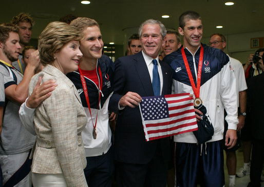 President George W. Bush and Mrs. Laura Bush pose for photos with U.S. Olympic swimmers Larsen Jensen, left, and Michael Phelps Sunday, Aug. 10, 2008, at the National Aquatics Center in Beijing. White House photo by Shealah Craighead