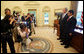 President George W. Bush stands with Sameer Mishra, 14, of Lafayette, Ind., during his visit Wednesday, Aug. 13, 2008, to the Oval Office of the White House. The teen was named the 2008 Scripps National Spelling Bee Champion in the 16th round after correctly spelling the word "guerdon," meaning a reward or recompense). White House photo by Joyce N. Boghosian