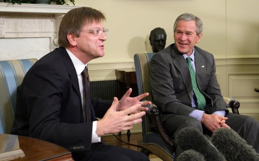 President George W. Bush breaks out in laughter as he listens to Belgian Prime Minister Guy Verhofstadt Tuesday, January 17, 2006, during the Prime Minister's visit to the Oval Office. White House photo by Paul Morse