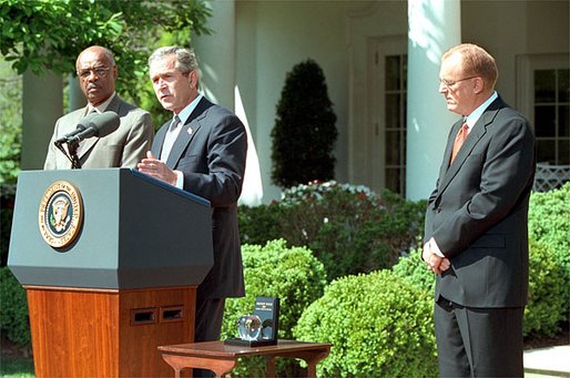 President George W. Bush and Secretary of Education Rod Paige present the 2002 Teacher of the Year award to Chauncey Veatch, right, in the Rose Garden at the White House Wednesday, April 24. Mr. Veatch is a social studies teacher at Coachella Valley High School in Thermal, Calif., White House photo by Paul Morse.