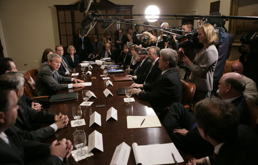 President George W. Bush answers a question from the press as he sits with members of the insurance, banking and business communities Tuesday, April 4, 2006, during a meeting at the White House on Health Care Initiatives. White House photo by Paul Morse