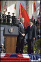 President George W. Bush shakes hands with President Hu Jintao of China after both leaders delivered remarks during a South Lawn arrival ceremony, Thursday, April 20, 2006. White House photo by Eric Draper
