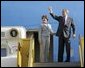 President George W. Bush gives a thumbs-up sign as he and Laura Bush depart Los Angeles Friday morning, Aug. 13. 2004. White House photo by Eric Draper.