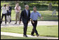 President George W. Bush and Rockey Vaccarella of New Orleans walk to the Oval Office after delivering a joint statement to the press on the South Lawn Wednesday, Aug. 23, 2006. Vaccarella, who lost his home in the wake of Hurricane Katrina, drove to Washington, D.C., with the hopes of speaking directly with President Bush. White House photo by Paul Morse