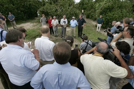 After touring the hurricane damage to Marty and Pat McKenna's orange groves, President George W. Bush addresses the media at the their farm in Lake Wales, Fla., Sept. 29, 2004. White House photo by Eric Draper.