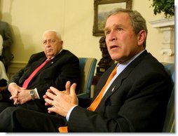 President George W. Bush answers questions from the press with Israeli Prime Minister Ariel Sharon in the Oval Office on Tuesday afternoon. White House photo by Paul Morse.