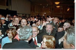 President George W. Bush wades into an enthusiastic crowd after speaking at the Hispanic National Prayer Breakfast in Washington, D.C., May 16, 2002. White House photo by Paul Morse.
