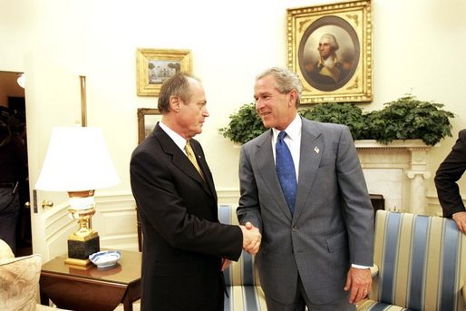 President George W. Bush shakes hands with Prime Minister Peter Medgyessy of Hungary at the end of their meeting in the Oval Office, Tuesday, June 22, 2004. White House photo by Eric Draper