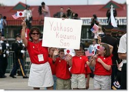 Children cheer the arrival of Japanese Prime Minister Junichiro Koizumi at Hunter Army Airfield in Savannah, Ga., June 8, 2004.  White House photo by Paul Morse