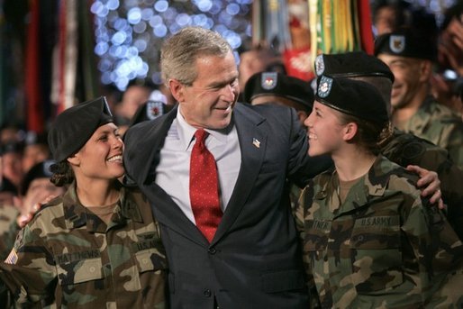 President George W. Bush joins soldiers on stage following his remarks at Fort Lewis, Washington, Friday, June 18, 2004. White House photo by Eric Draper.