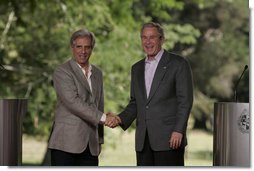 President George W. Bush and President Tabare Vazquez shake hands after a their joint press availability Saturday, March 10, 2007, at Estancia Anchorena. President Bush pledged to work hard for a compassionate and rational immigration law "that respects the rule of law, but also respects the great traditions of the United States, a tradition which is a welcoming society."  White House photo by Paul Morse