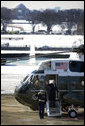 President George W. Bush waves from the steps of Marine One on the South Lawn of the White House, Thursday, March 8, 2007, as he departs for a six-day trip to Latin America. White House photo by David Bohrer