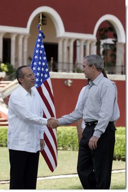 President George W. Bush exchanges handshakes with Felipe Calderon, President of Mexico, during the arrival ceremonies Tuesday, March 13, 2007, welcoming the President and Mrs. Bush to the country. President Calderon told the President, "Mr. President, I have no doubt that together our governments will move forward in the generation of new opportunities of well-being and prosperity for our nations. Please feel very, very welcome to Mexico." White House photo by Paul Morse