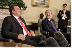 President George W. Bush and German Chancellor Gerhard Schroeder talk with the media in the Oval Office Monday, June 27, 2005.  White House photo by Eric Draper