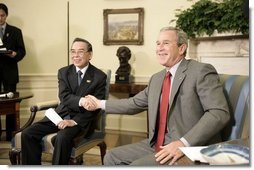 President George W. Bush and Prime Minister Phan Van Khai of Vietnam deliver statements to the media in the Oval Office Tuesday, June 21, 2005. "We discussed our economic relations. And I noted that the Vietnamese economy is growing quite substantially. We talked about our desire for Vietnam to join the WTO," said the President. "We talked about security issues and a mutual desire to coordinate in the war on terror."  White House photo by Eric Draper