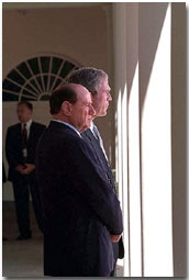 President George Bush and Italy's Prime Minister Silvio Berlusconi talk on the colonnade outside of the Oval Office Oct. 15. White House photo by Tina Hager.