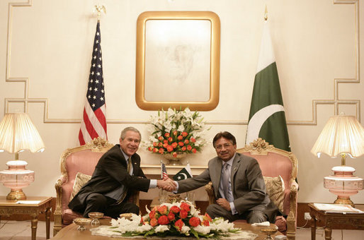 President George W. Bush is welcomed by Pakistan President Pervez Musharraf to Aiwan-e-Sadr in Islamabad, Pakistan, Saturday, March 4, 2006. White House photo by Eric Draper