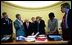 President George W. Bush and senior advisors look at a map of Iraq on the Resolute Desk in the Oval Office April 2, 2003. Pictured, from left, are Gen. Richard Myers, Vice President Dick Cheney, Chief of Staff Andy Card, Defense Secretary Donald Rumsfeld, National Security Advisor Dr. Condoleezza Rice and Defense Under Secretary Paul Wolfowitz.