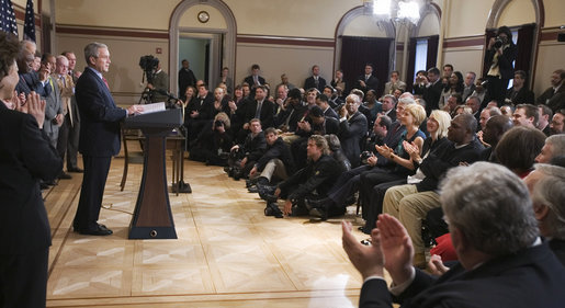 President George W. Bush and members of the audience acknowledge Thomas Boyd, at right in dark shirt, after the President mentioned him in remarks Wednesday, April 9, 2008, during the signing of H.R. 1593, the Second Chance Act of 2007. The Second Chance Act aims to reduce prison populations and corrections costs by reducing the recidivism rate by providing federal funding to develop programs dealing with job training, substance abuse, and family stability. In acknowledging Mr. Boyd, a 53-year-old graduate of the Jericho re-entry program in Baltimore, the President said, "I want to thank you for coming, Thomas. There's a lot of other Thomases out there that we're going to help with this bill." White House photo by Eric Draper