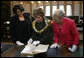 Mrs. Laura Bush is shown a rare book during her visit Saturday, April 5, 2008, to the Croatian State Archives in Zagreb. White House photo by Shealah Craighead