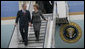 President George W. Bush and Mrs. Laura Bush steal a moment as they deplane Air Force One Wednesday, April 2, 2008, upon their return to Bucharest from the Romanian presidential retreat in Neptun, Romania. White House photo by Shealah Craighead