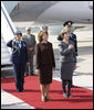 Mrs. Laura Bush holds her hand over her heart during the playing of the national anthem Wednesday, April 2, 2008, as she stands with Mrs. Maria Basescu, spouse of Romania's President Traian Basescu, on the red carpet during the arrival ceremony at Mihail Kogalniceanu Airport in Constanta, Romania. White House photo by Eric Draper