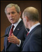 President George W. Bush looks toward President Vladimir Putin Sunday, April 6, 2008, while making remarks during a joint press availability at the State Resident of the President of Russia in Sochi. White House photo by Chris Greenberg