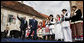 President George W. Bush waves as he arrives on stage with Prime Minister Ivo Sanader of Croatia, Saturday, April 5, 2008, at St. Mark's Square in Zagreb. Thousands of people turned out in the square to hear President Bush tell them, "Croatia is a very different place than it was just a decade ago. The Croatian people have overcome war and hardship to build peaceful relations with your neighbors, and to build a maturing democracy in one of the most beautiful countries on the face of the Earth." White House photo by Eric Draper