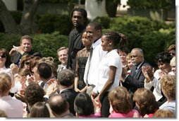 From left: Wendall Jefferson, Ta-Sha Watkins, Marco Jeter and Brandy Beaman receive applause as they stand after being acknowledged by their math teacher, Jason Kamras, the 2005 National Teacher of the Year, during ceremonies at the Rose Garden. White House photo by Krisanne Johnson