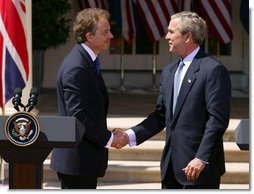 President George W. Bush and Prime Minister Tony Blair shake hands after a press conference in the Rose Garden of the White House on April 16, 2004.  White House photo by Paul Morse