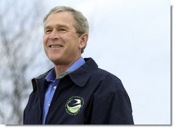 President George W. Bush smiles during his introduction before delivering remarks on Earth Day at Wells National Estuarine Research Reserve in Wells, Maine, Thursday, April 22, 2004. "The importance about Earth Day is that it reminds us that we can't take the natural wonders for granted. That's what Earth Day says to me, and I hope it says to you, as well, that we have responsibilities to the natural world to conserve that which we have and to make it even better," said the President in his remarks.  White House photo by Eric Draper