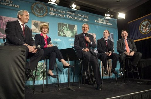 President George W. Bush participates in a conversation on the benefits of health care information technology with, from left, Anthony Principi, Secretary of Veterans Affairs, Marlene Miller, M.D. of John Hopkins Children's Center, Dennis Smith of VA Maryland Health Care System and Tommy Thompson, Secretary of Health and Human Services at the Department of Veterans Affairs Medical Center in Baltimore, Maryland on April 27, 2004. White House photo by Paul Morse