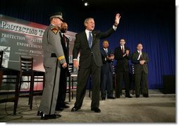 President George W. Bush waves to the audience during a conversation on the USA Patriot Act in Buffalo, N.Y., Tuesday, April 20, 2004.  White House photo by Eric Draper