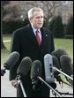 President George W. Bush speaks to the media Thursday, Dec. 22, 2005, on the South Lawn of the White House before leaving for Camp David. The President spoke about the Patriot Act extension saying, "We're still under threat, there's still an enemy that wants to harm us and they understand the Patriot Act is an important tool for those of us here in the Executive Branch to use to protect our fellow citizens." White House photo by Kimberlee Hewitt