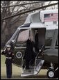 President George W. Bush waves to onlookers as he boards Marine One on the South Lawn Thursday, Dec. 22, 2005, en route to Camp David, where he and family will enjoy the Christmas holiday. White House photo by Kimberlee Hewitt