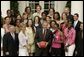 President George W. Bush and members of Baylor University's Lady Bears NCAA basketball team erupt in laughter Wednesday, July 20, 2005, during their Rose Garden visit at the White House. White House photo by Paul Morse