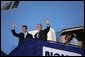 President George W. Bush and Prime Minister Anders Fogh Rasmussen wave from Air Force One upon the President's arrival to Kastrup, Denmark, Tuesday, July 5, 2005. White House photo by Krisanne Johnson