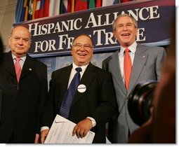 President George W. Bush meets with Chile's Jose Miguel Insulza, left, Secretary General, Organization of American States and Raul Yzaguirre, center, CEO of the National Council of La Raza, Thursday, July 21, 2005, following the President's address to the Hispanic Alliance for Free Trade in Washington.  White House photo by Eric Draper