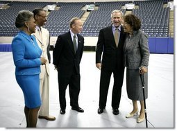 President George W. Bush is joined backstage by event participants before delivering remarks at the Indiana Black Expo Corporate Luncheon in Indianapolis, Ind., Thursday, July 14, 2005. Pictured with the President, from left are: Indiana Black Expo President Joyce Rogers, Chairman Arvis Dawson, Indiana Governor Mitch Daniels, and Congresswoman Julia Carson.  White House photo by Eric Draper