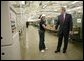 President George W. Bush greets a worker during a tour of R.I. Stowe Mills - Helms Plant in Belmont, N.C., Friday, July 15, 2005. White House photo by Eric Draper