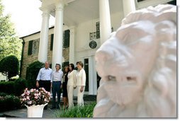 President George W. Bush, Laura Bush and Japanese Prime Minister Junichiro Koizumi are welcomed to Graceland, the home of Elvis Presley, by his former wife Priscilla Presley and their daughter Lisa-Marie Presley, Friday, June 30, 2006 in Memphis. White House photo by Eric Draper